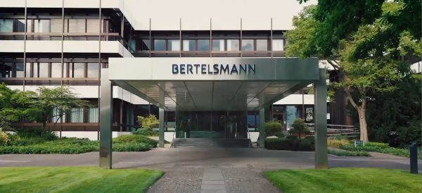 Office front of Bertelmann building, logo on metal entrance archway