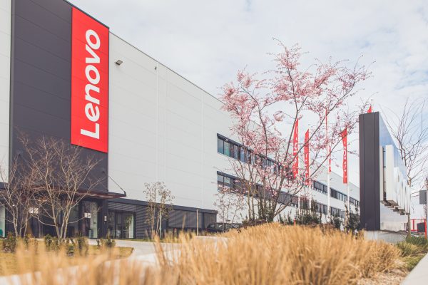 Factory building with Lenovo logos outside.