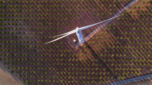 Aerial image of a turbine in a field.