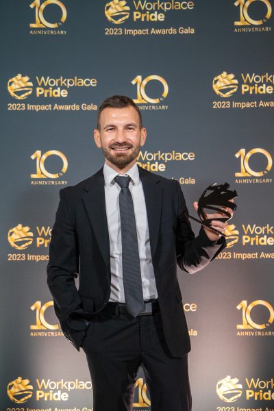 Man collecting awards trophy