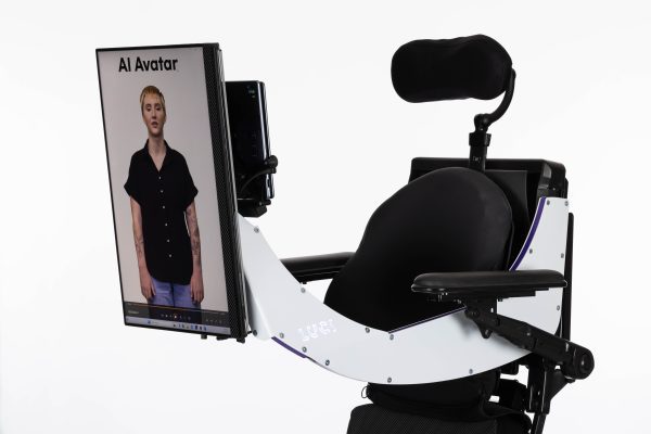 Erin's avatar on an outward-facing screen mounted to a custom LUCI Mobility wheelchair