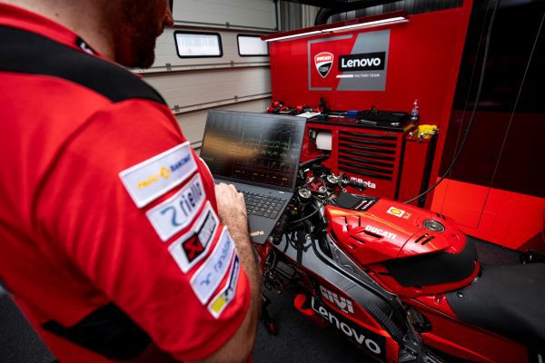 Ducati team using a Lenovo laptop to check data.