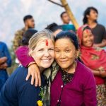 Courtney Mattar, Director of Partnerships (L) embraces Tulumaya Gurung (R), community member of Katheswora, Nepal - a village receiving support from Wine To Water.