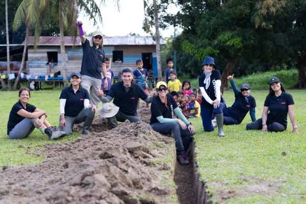 Lenovo employees and Wine To Water staff take a break from digging water infrastructure in the Amazon.