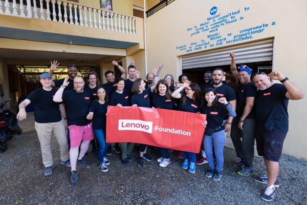 Lenovo employees celebrating after a successful service project in the Dominican Republic.