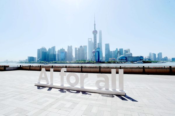 AI for all sign outside with Shanghai in the background