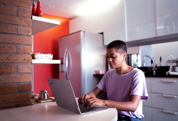 Brand image - Person working remotely on a Lenovo laptop.