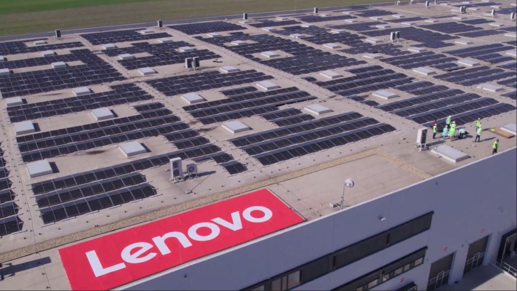 solar panels on the roof of a building with Lenovo logo in red