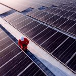 Lenovo brand image - technician working on solar panels