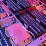 Lenovo Neptune Cooling close up inside a server with pink lighting.