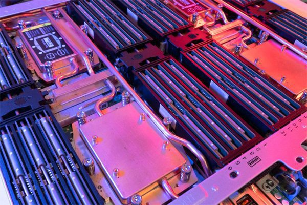 Lenovo Neptune Cooling close up inside a server with pink lighting.